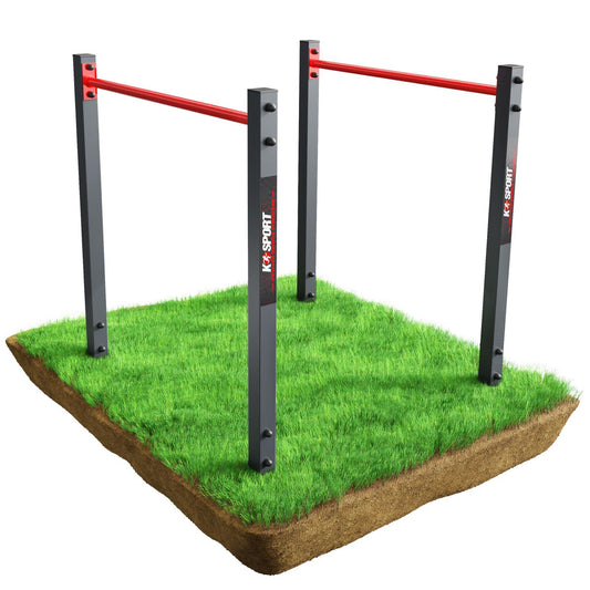 Outdoor fitness equipment with red bars on a grassy platform