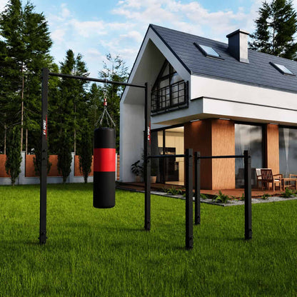 Outdoor pull-up and dip station with hanging punching bag for boxing and functional fitness training