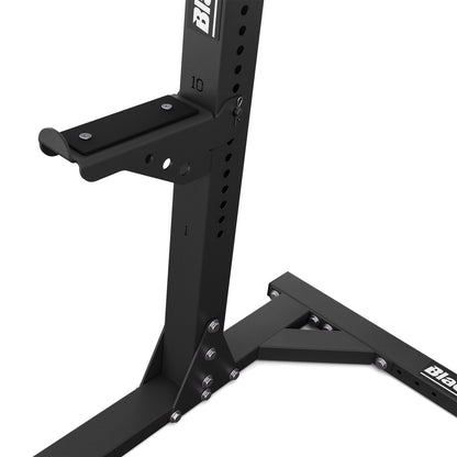 Adjustable barbell holder system on professional squat rack for safe strength training exercises