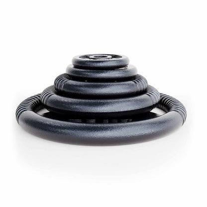 K-Sport cast iron weight plates stacked in different sizes for strength training